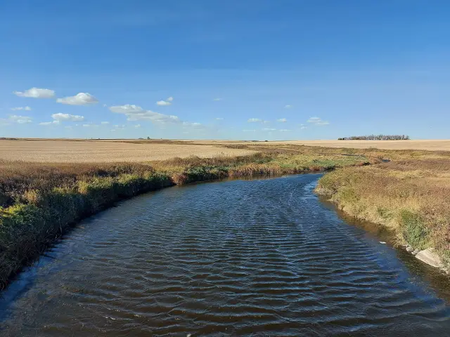 Long Creek winding through prairie farmland